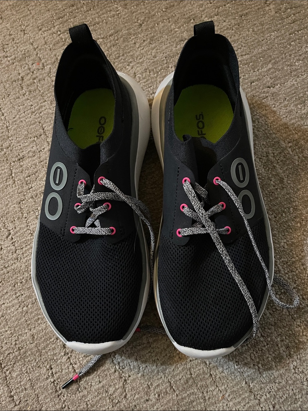 OOFOS Black Slip-On Sneakers with Pink Eyelets and White Soles